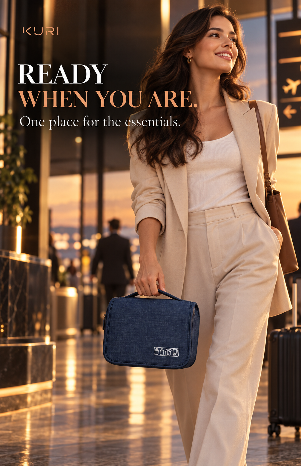 Traveller carrying a navy blue hanging toiletry bag by its top handle