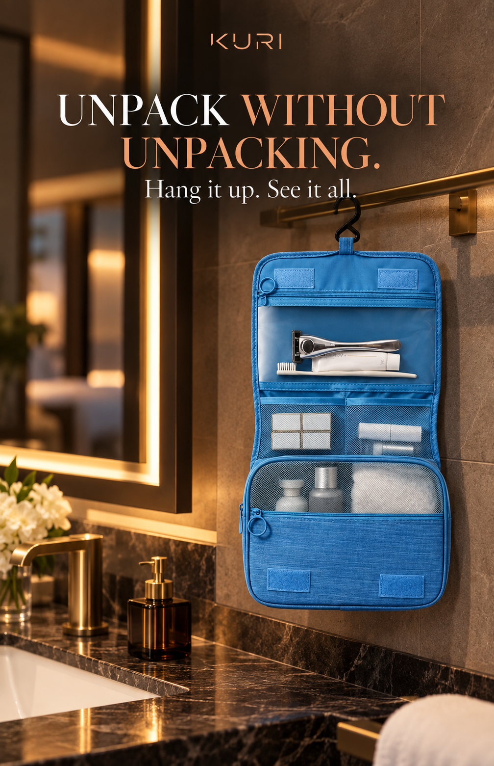 Blue toiletry bag hanging unfolded from a bathroom rail with toiletries organised in separate pockets